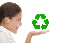 Young woman holding recycling image in her hand