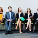 Row of male and female job seekers