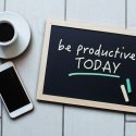 A chalkboard with "be productive today" written in chalk