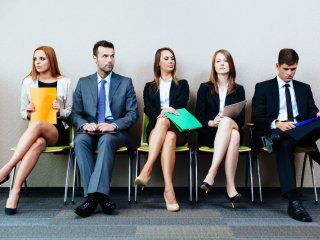 Row of male and female job seekers
