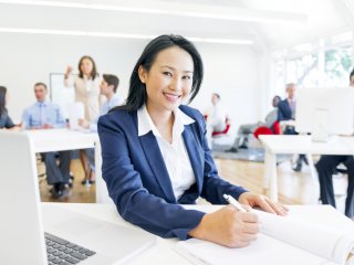 Young female professional in office setting
