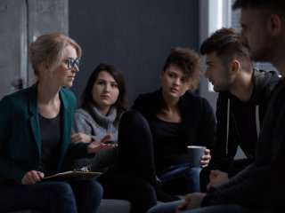 Female counselor leading a support group
